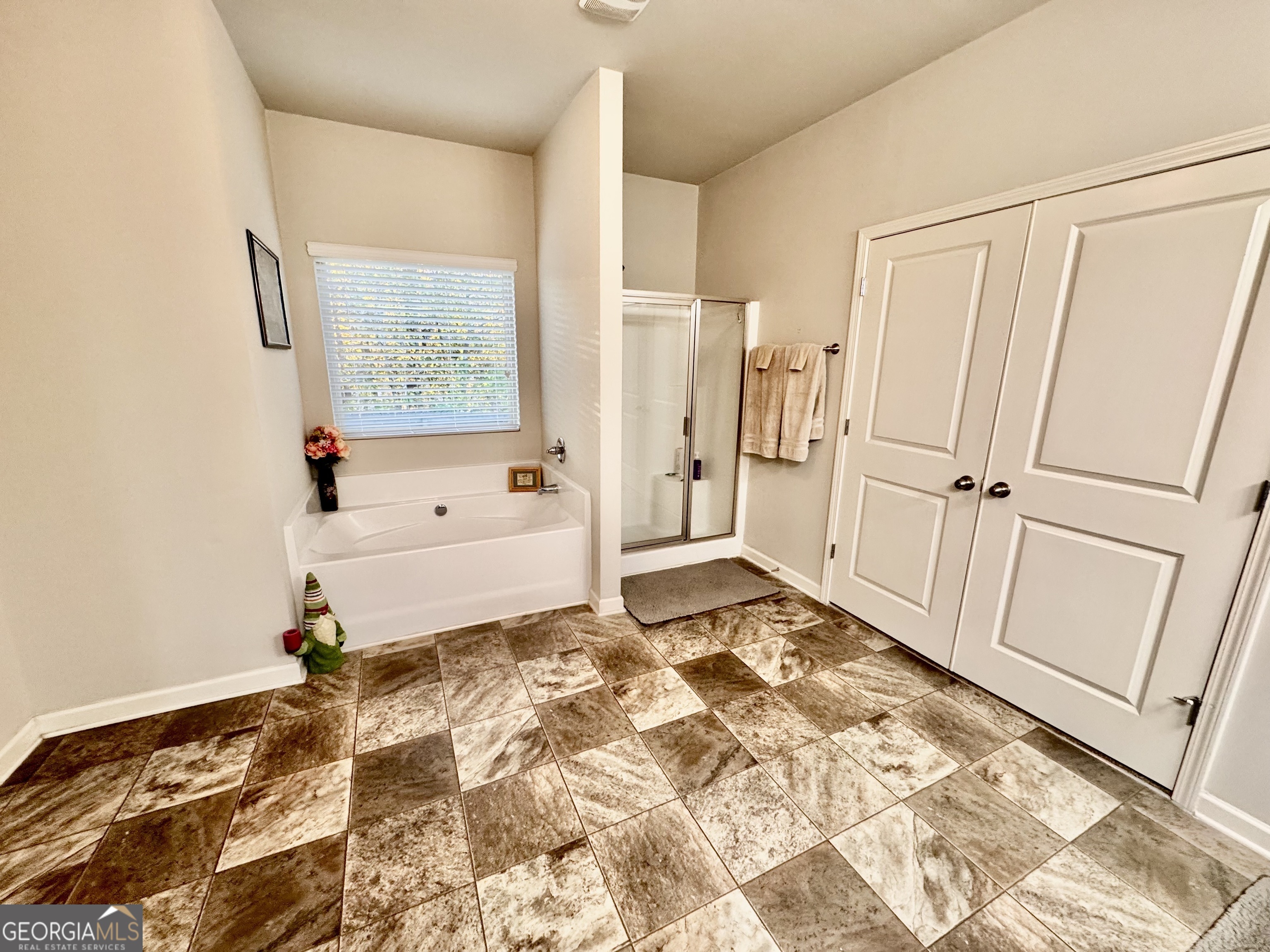 52 Pulaski Avenue Hampton, GA 30228 - Photo 23 of 32 a bathroom with a sink toilet and shower