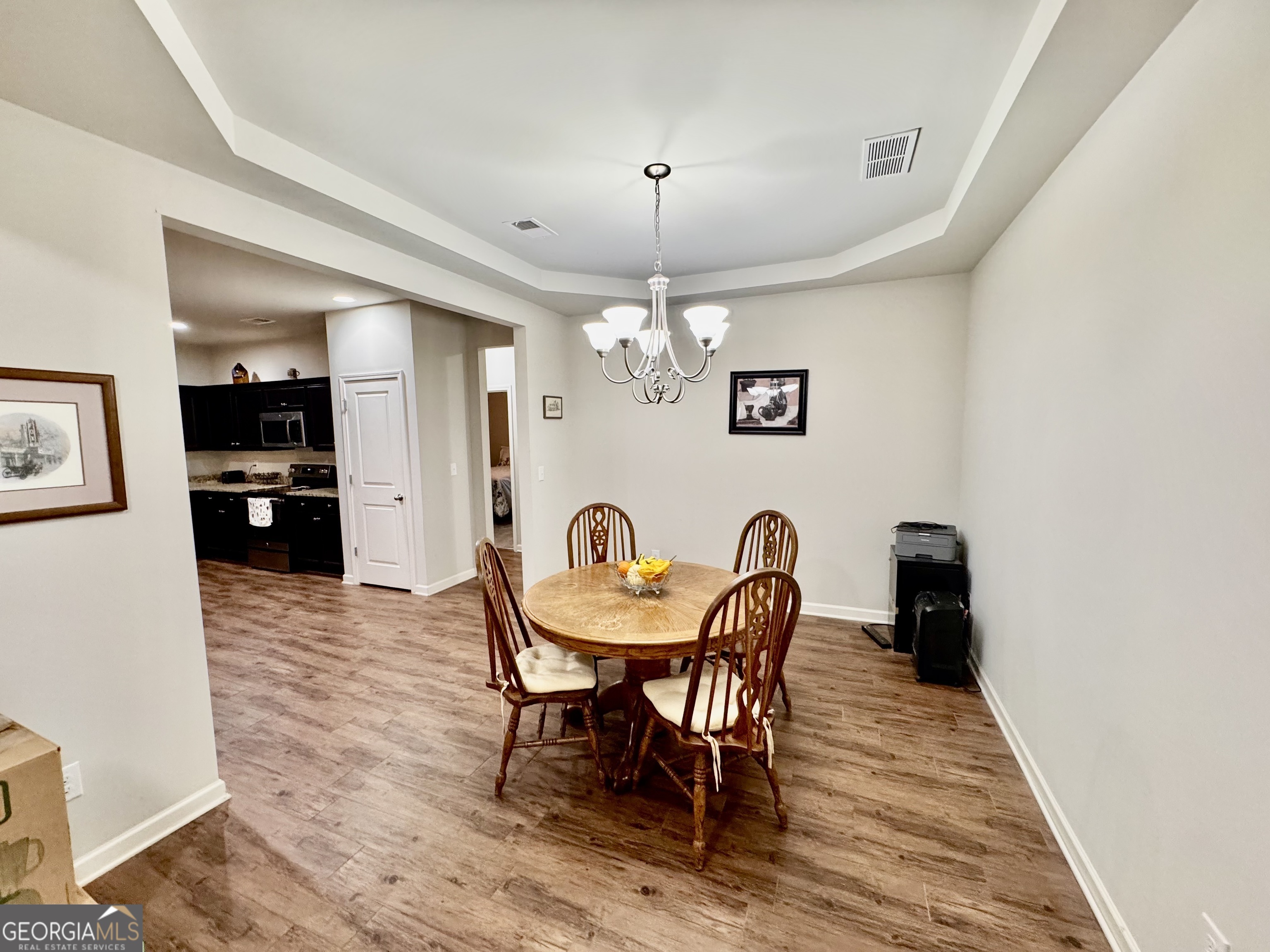 52 Pulaski Avenue Hampton, GA 30228 - Photo 7 of 32 a view of a dining room with furniture and wooden floor