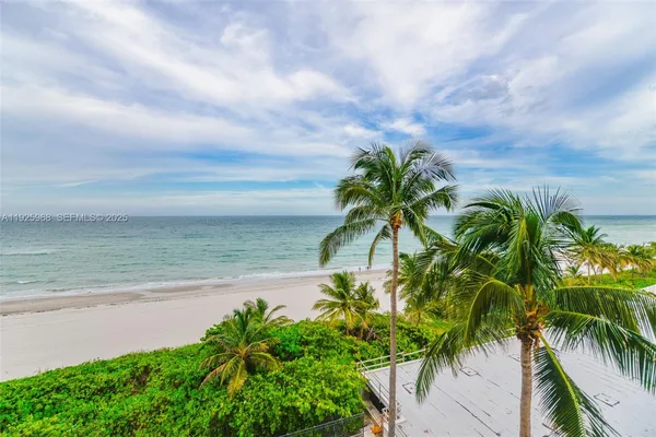 a view of a yard with an ocean