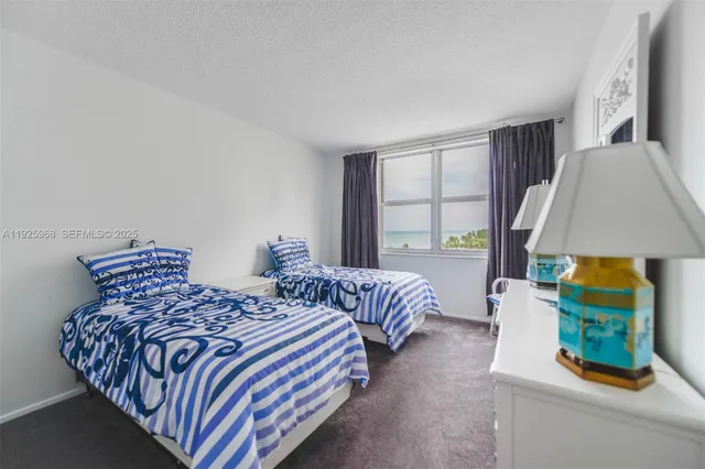 a bedroom with bed and a window