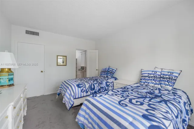 a bedroom with double bed and a window