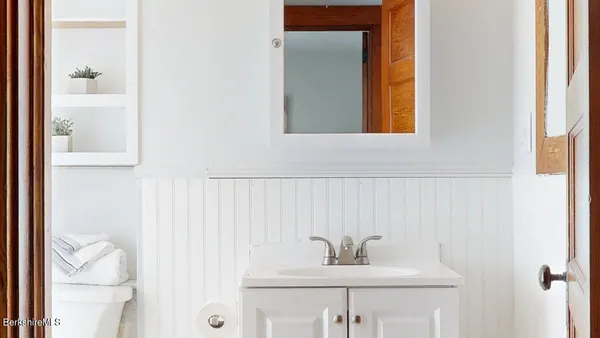 a bathroom with a sink and a mirror