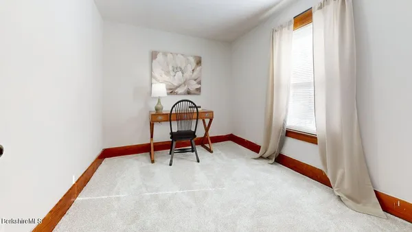 a room with furniture and air hockey table