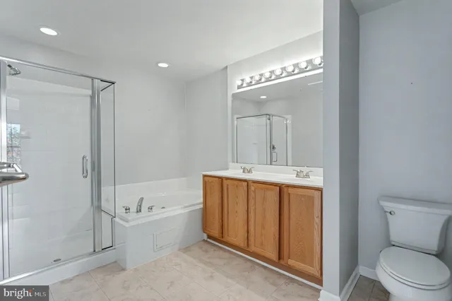 a bathroom with a toilet a sink and bathtub