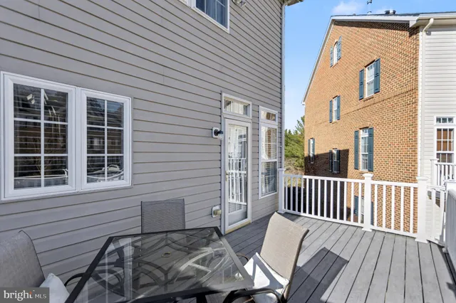 a view of a chair and table in the balcony