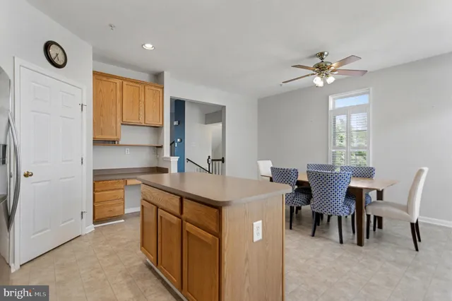 a kitchen that has a cabinets and a table in it