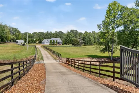a view of a wooden deck with a yard