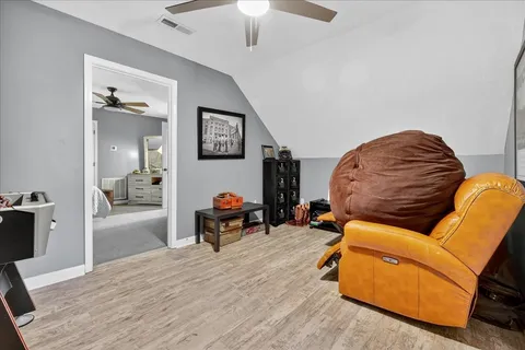 a bathroom with a toilet a sink and shower
