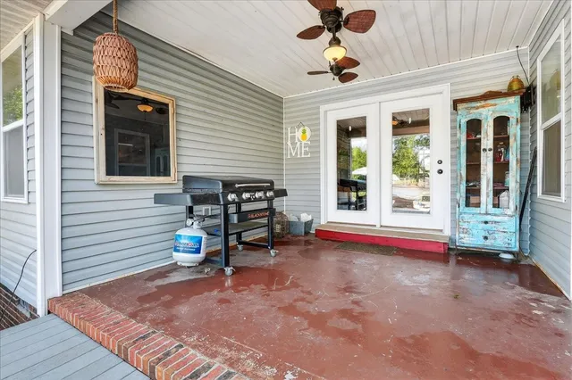 a view of a house with pool and chairs