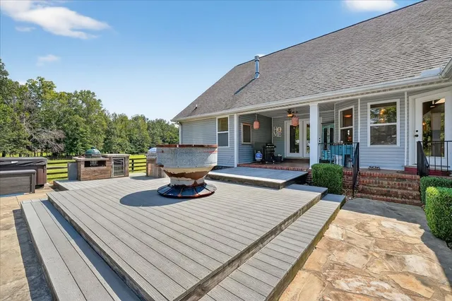 a view of a swimming pool with an outdoor space and seating area