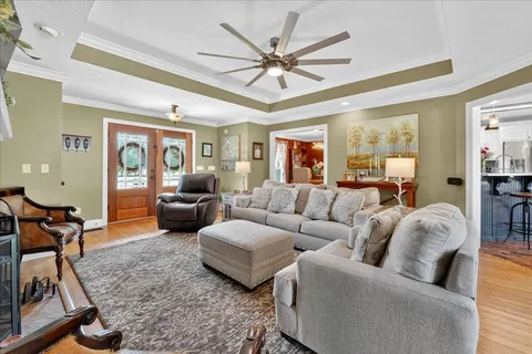 a view of a dining room with furniture and wooden floor