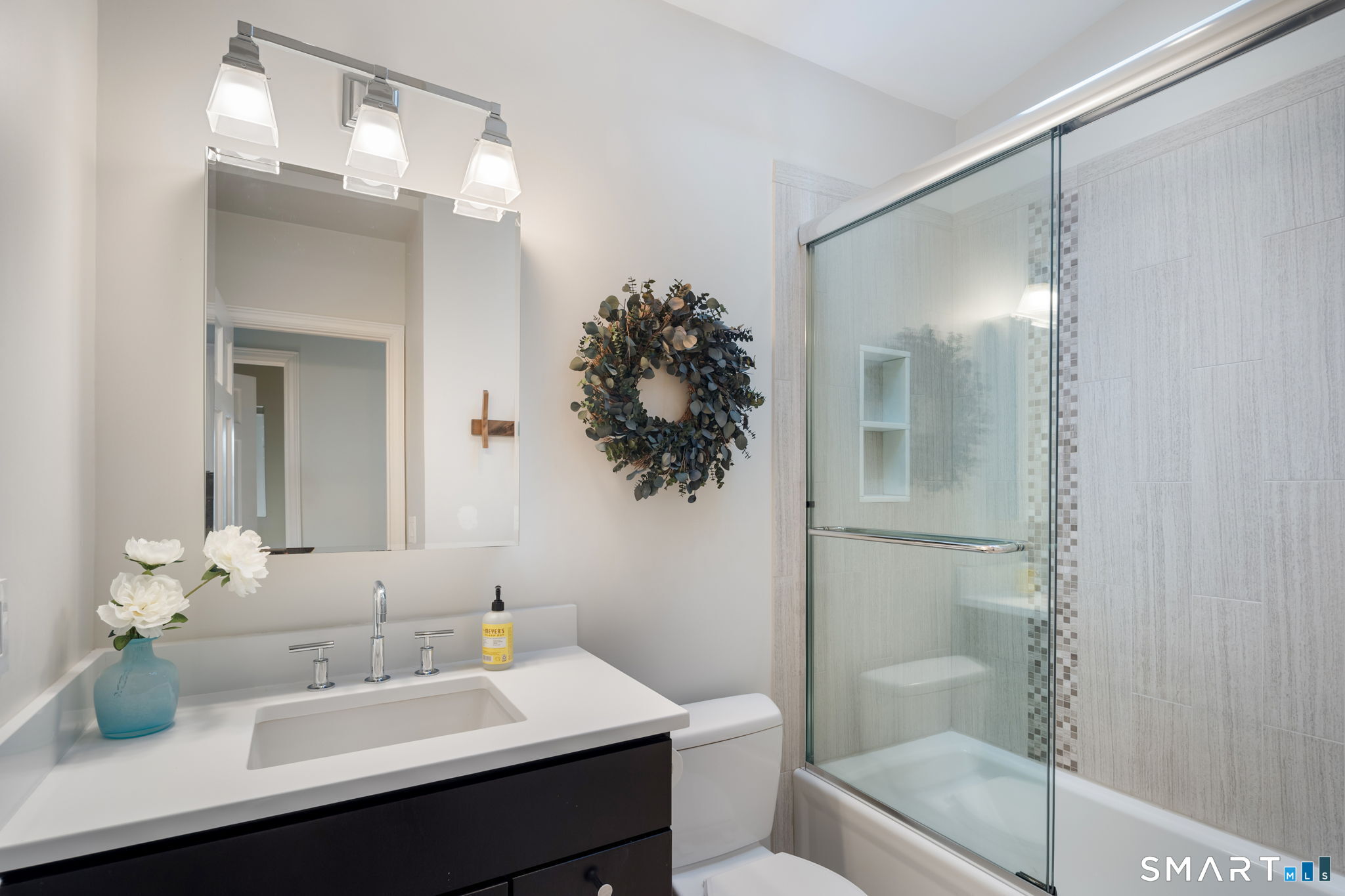 12 Splitrock Road Norwalk, CT 06854 - Photo 15 of 37 a bathroom with a sink toilet and shower