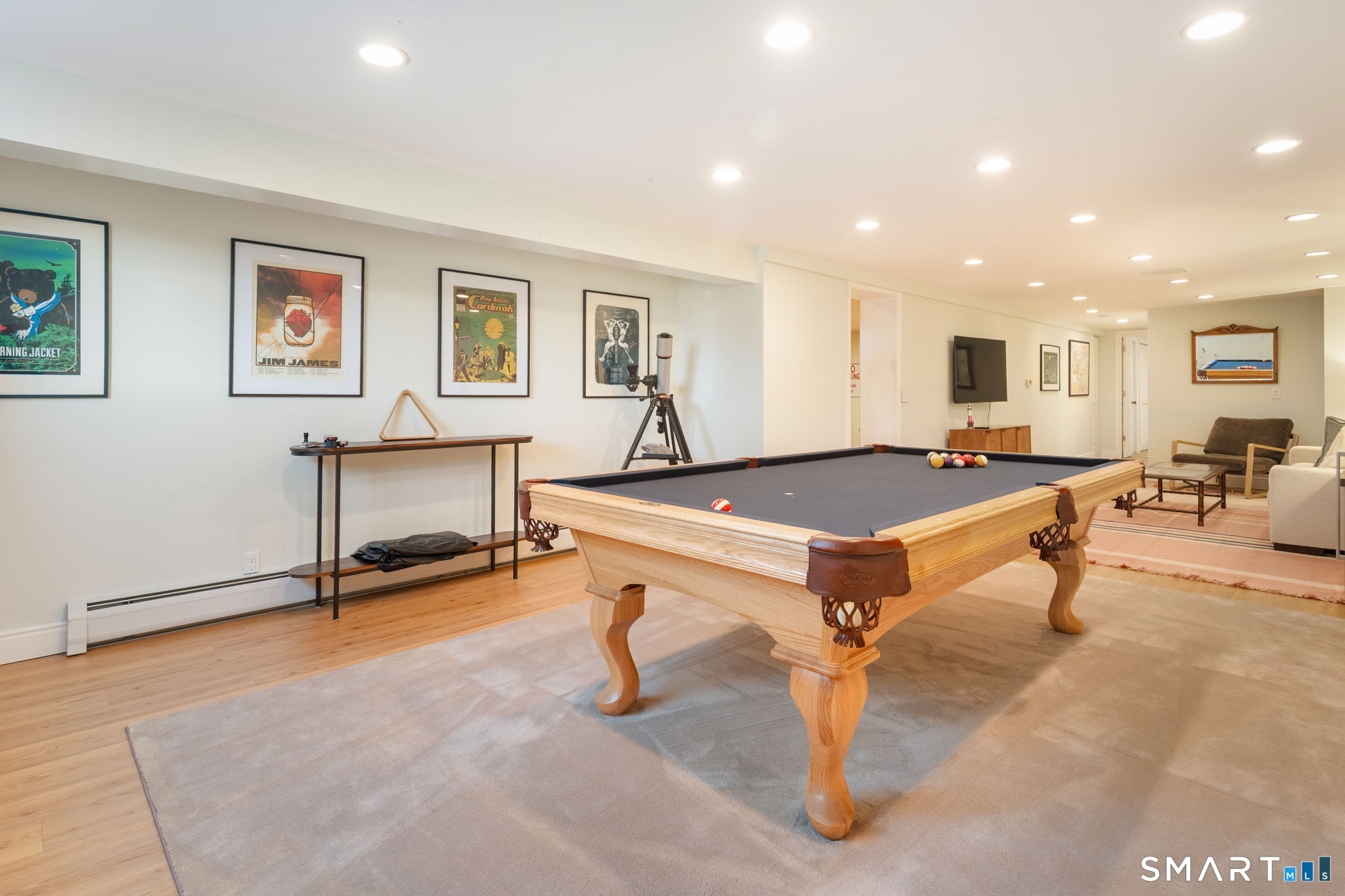 12 Splitrock Road Norwalk, CT 06854 - Photo 17 of 37 a living room with furniture pool table and glass door