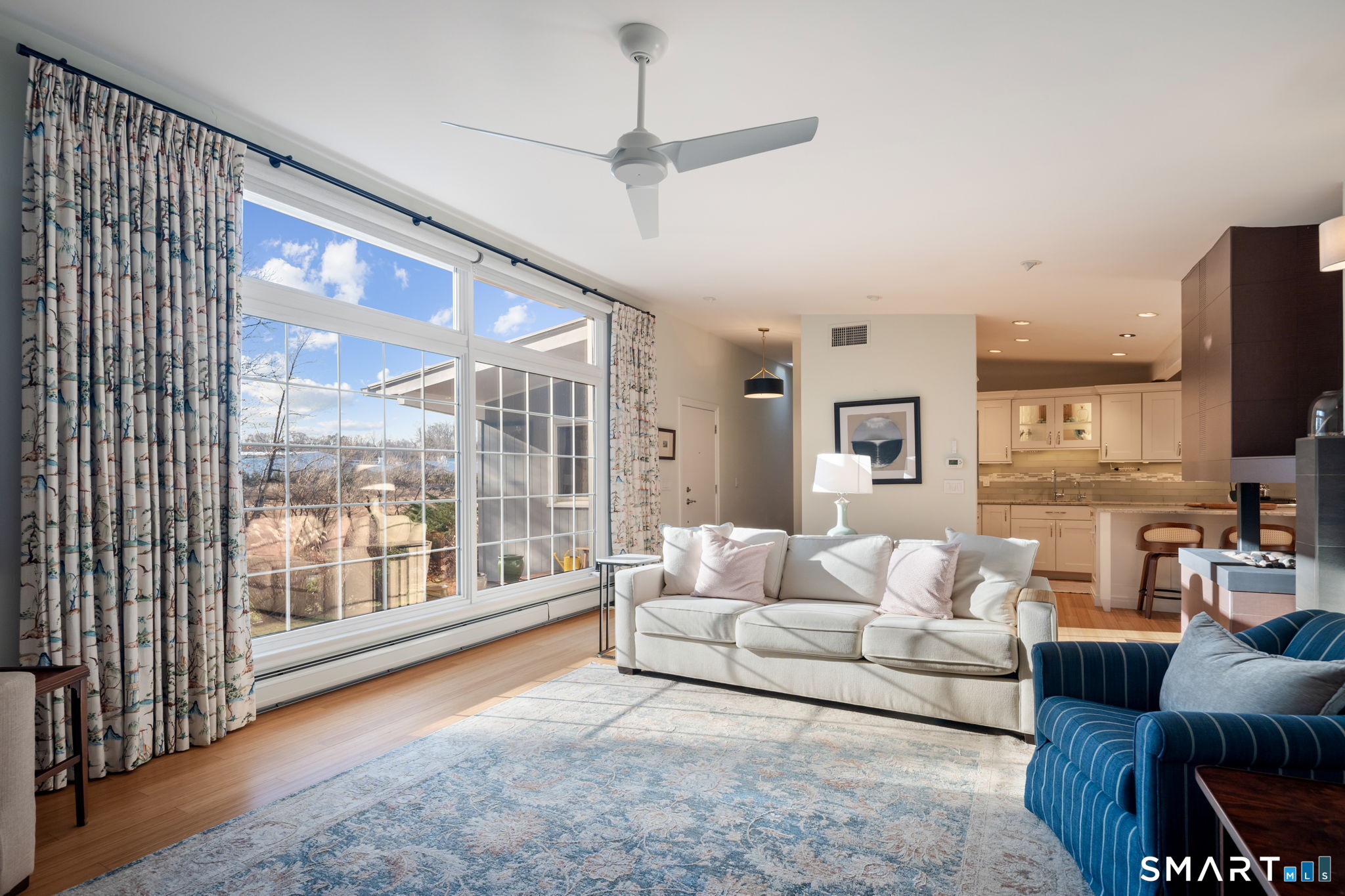 12 Splitrock Road Norwalk, CT 06854 - Photo 22 of 37 a living room with furniture and a flat screen tv