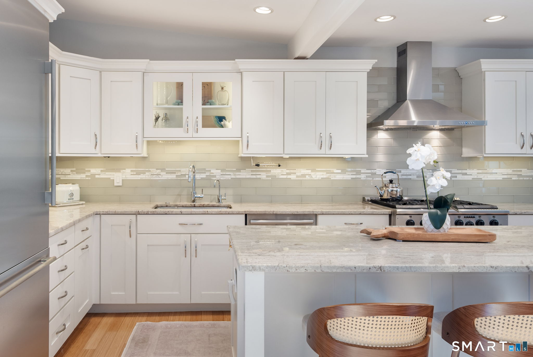 12 Splitrock Road Norwalk, CT 06854 - Photo 23 of 37 a kitchen with stainless steel appliances granite countertop a sink stove and cabinets