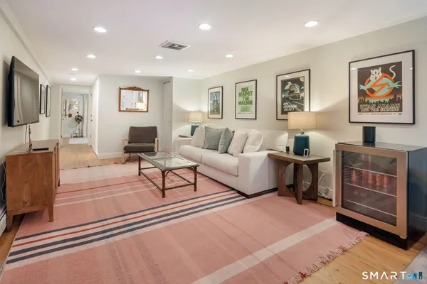 a living room with furniture and a piano