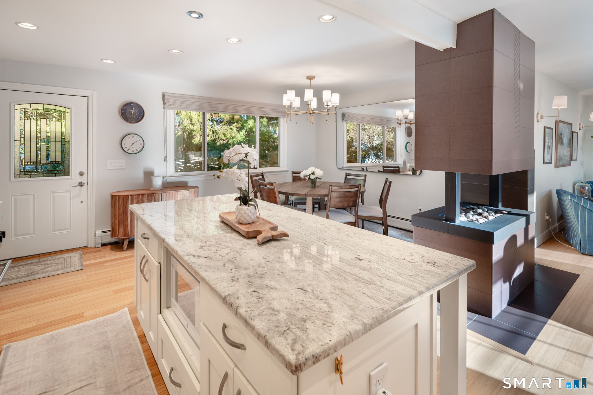 12 Splitrock Road Norwalk, CT 06854 - Photo 5 of 37 a dining hall with stainless steel appliances granite countertop a stove and a dining table