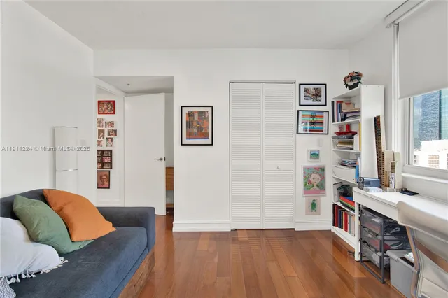 a bathroom with a tub sink and a window