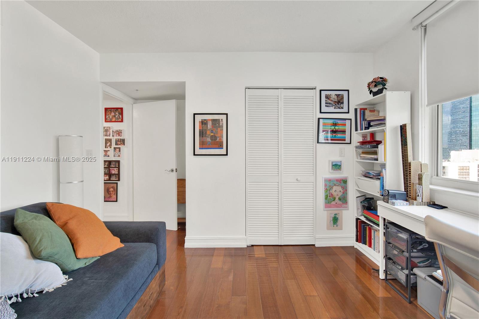 31 Southeast 5th Street, Unit 2910 Miami, FL 33131 - Photo 16 of 34 a living room with furniture and a wooden floor