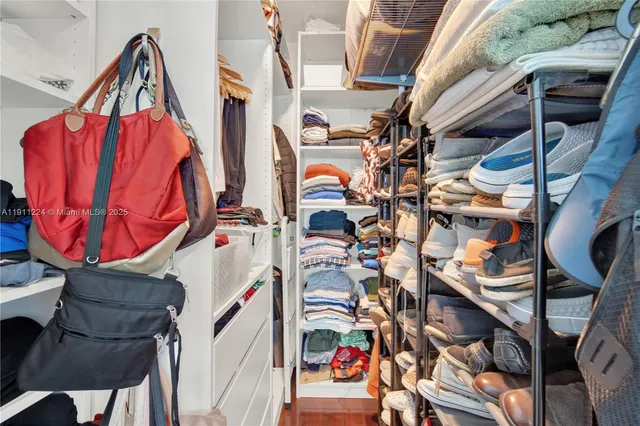a bathroom with a sink vanity mirror and toilet