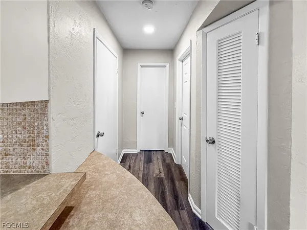 a view of a storage and utility room with washer and dryer