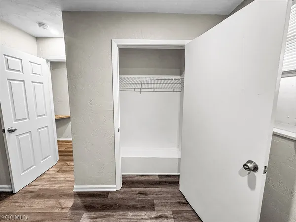 a bathroom with a sink a toilet a mirror and shower