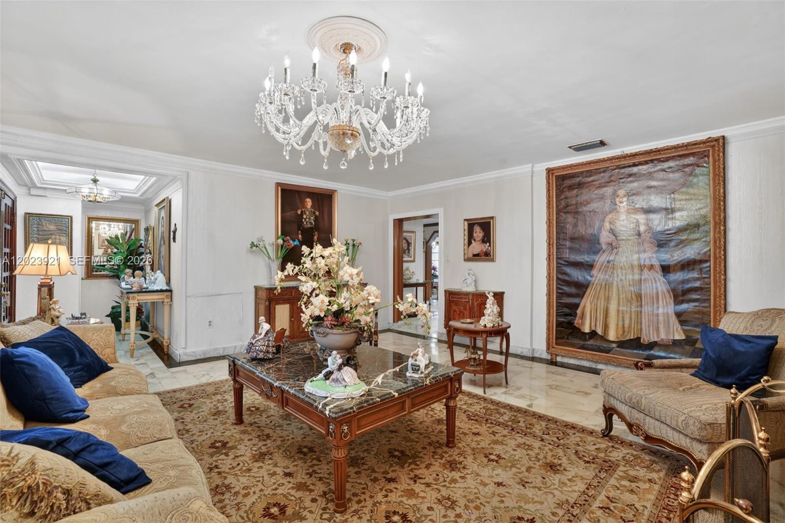 8461 Southwest 68th St Road Miami, FL 33143 - Photo 36 of 65 a living room with furniture chandelier and a table