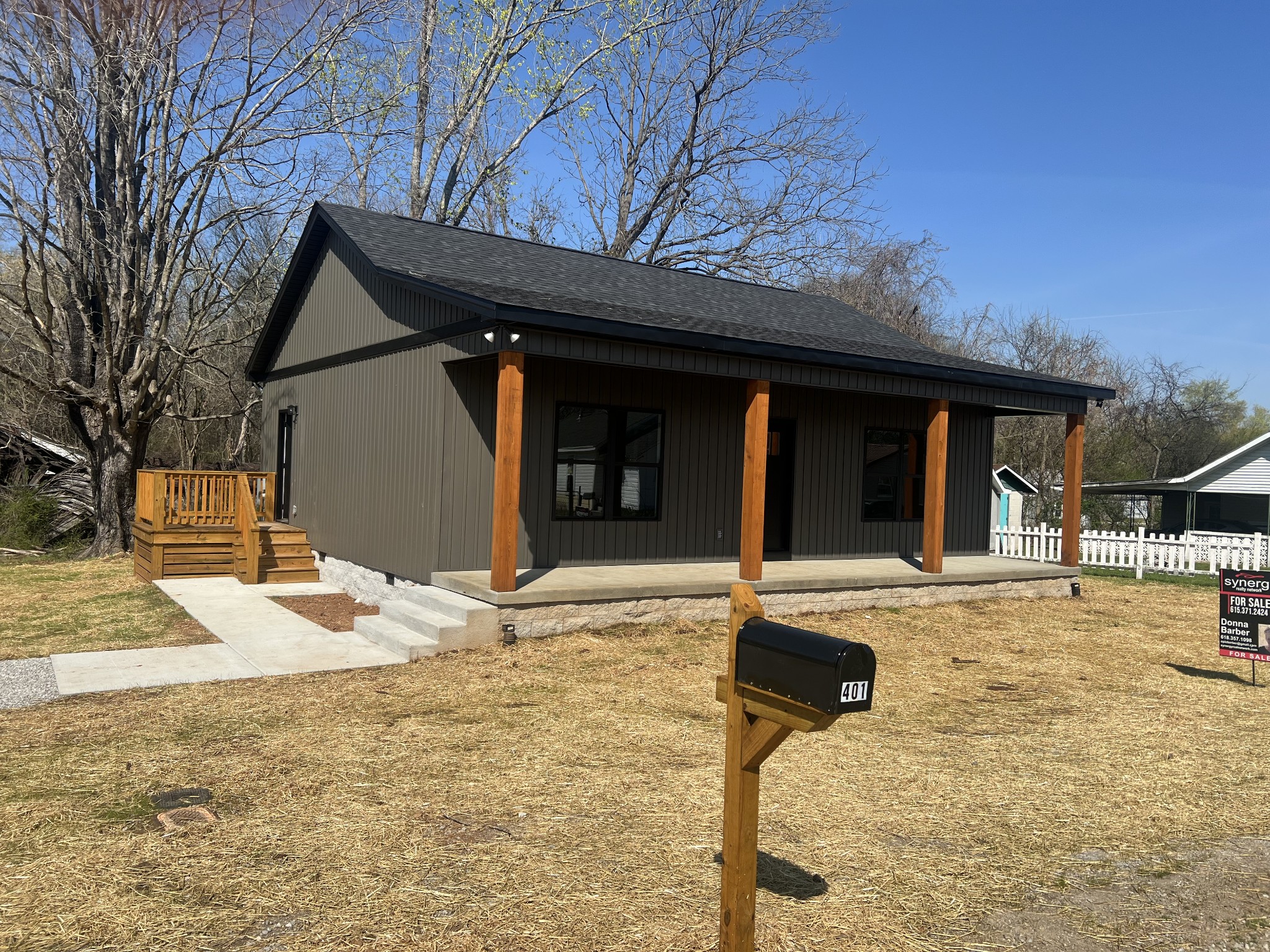 401 Hawkins Street Cowan, TN 37318 - Photo 1 of 15 a backyard of a house with table and chairs