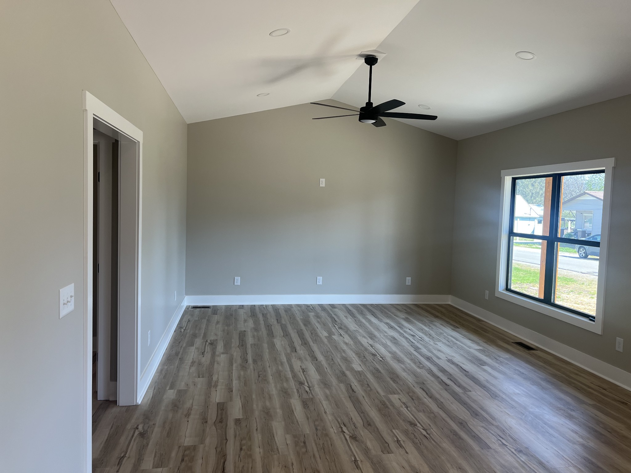 401 Hawkins Street Cowan, TN 37318 - Photo 7 of 15 wooden floor in an empty room with a window