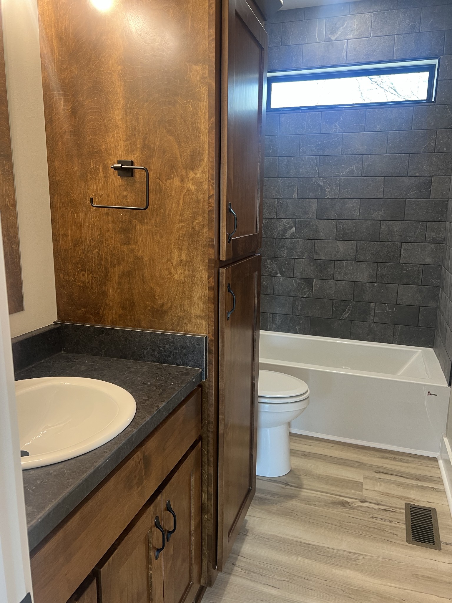 401 Hawkins Street Cowan, TN 37318 - Photo 10 of 15 a bathroom with a granite countertop sink toilet and shower