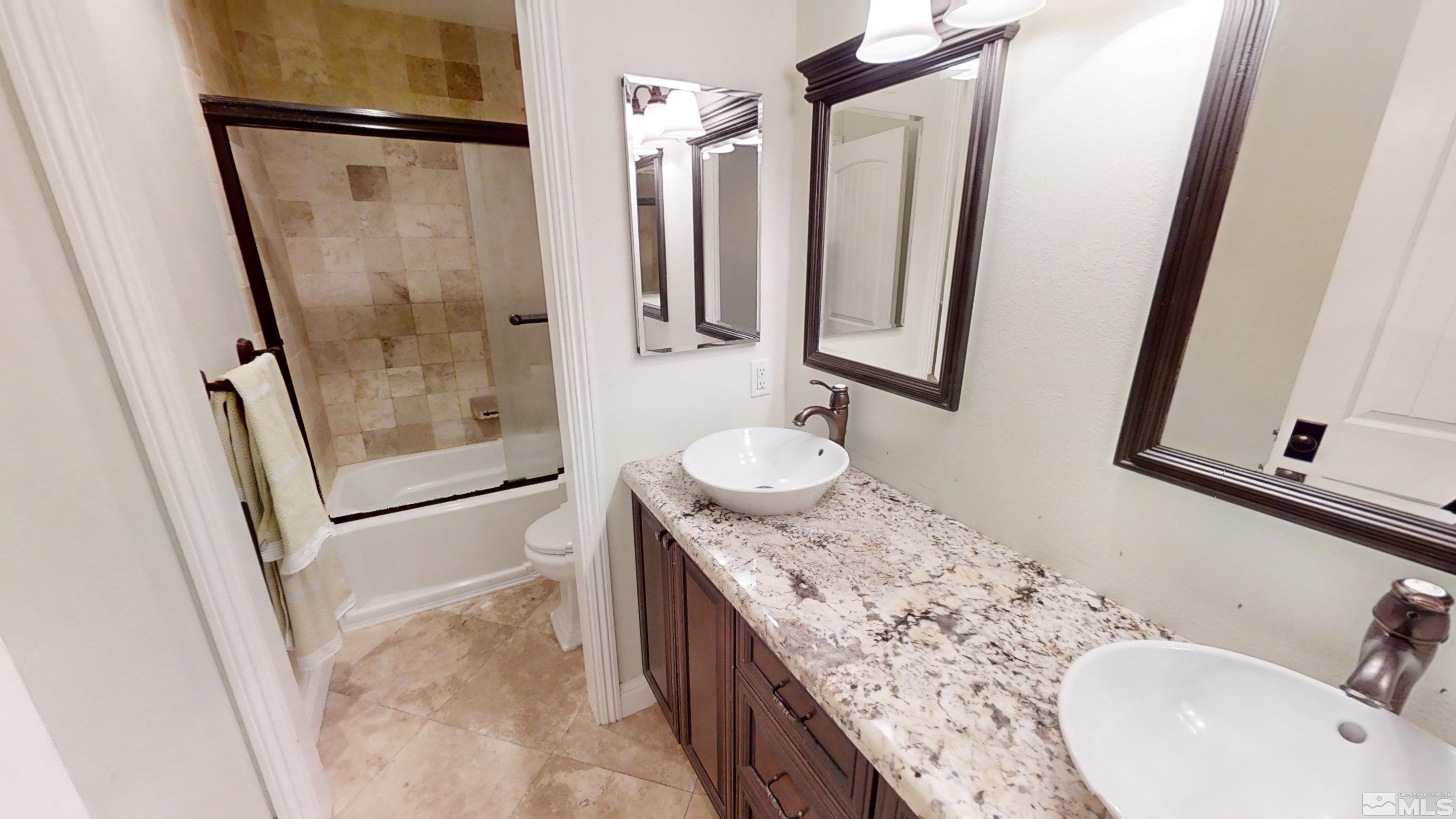 22850 Carriage Drive Reno, NV 89521 - Photo 25 of 35 a bathroom with a granite countertop sink toilet and shower