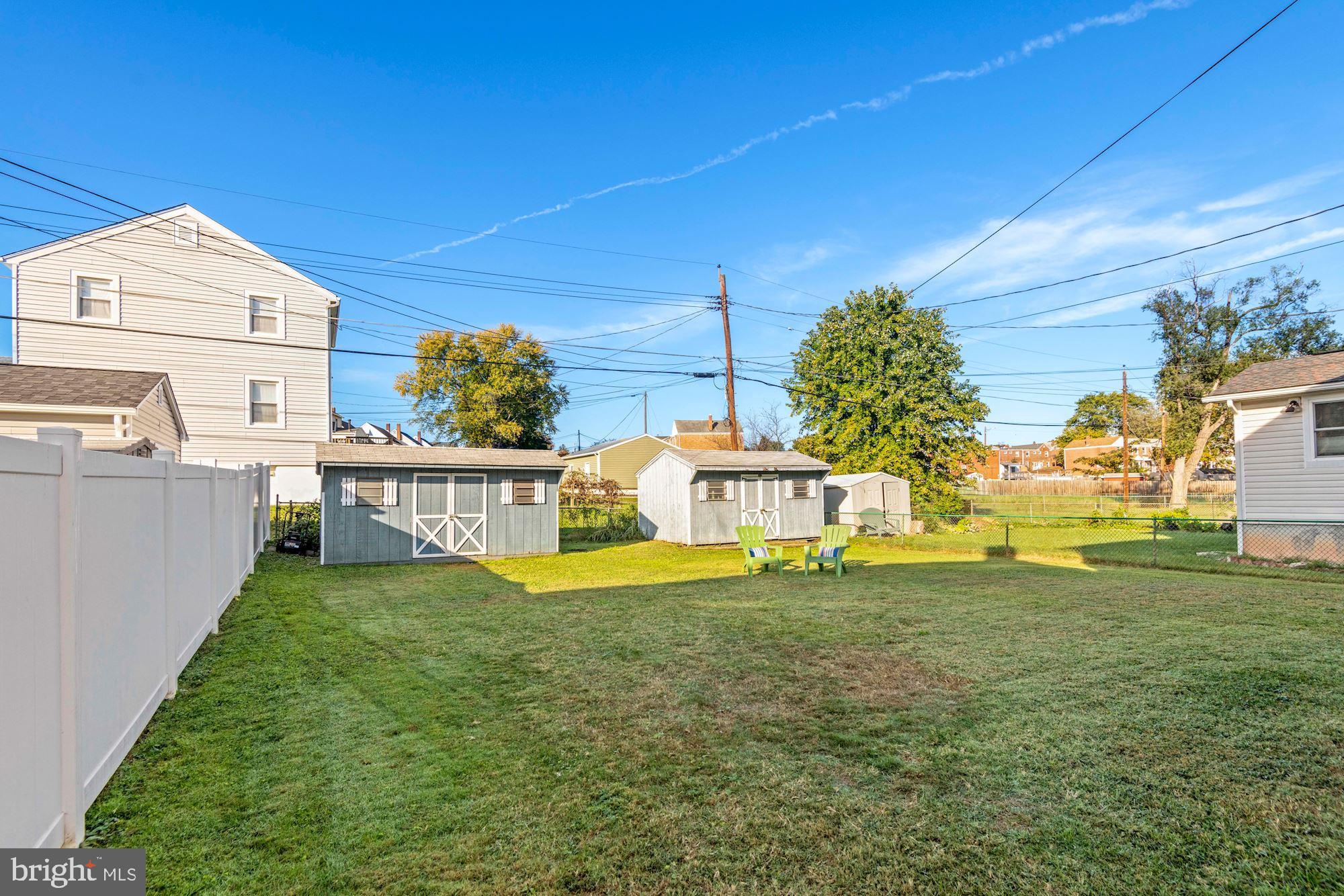 5524 Ashbourne Road Baltimore, MD 21227 - Photo 23 of 23 a view of a house with a yard and sitting area