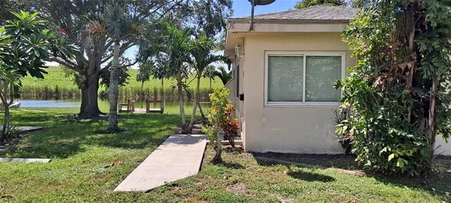 front view of a house with a garden