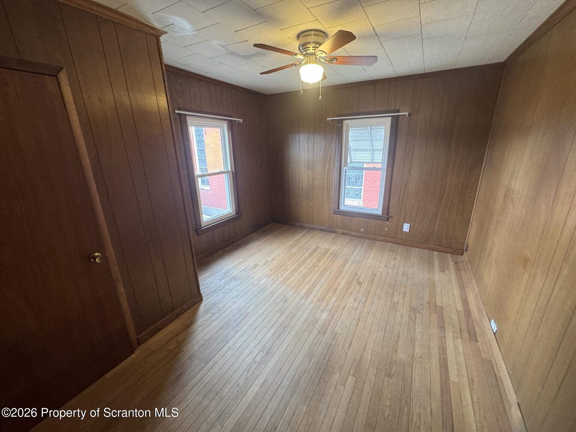 209 South Main Avenue Scranton, PA 18504 - Photo 10 of 12 wooden floor in an empty room with a window