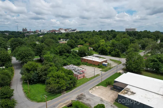 an aerial view of a house with yard