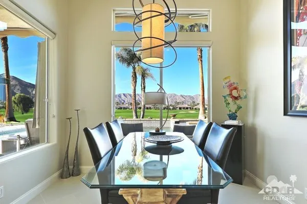 a view of a dining room with furniture window and outside view