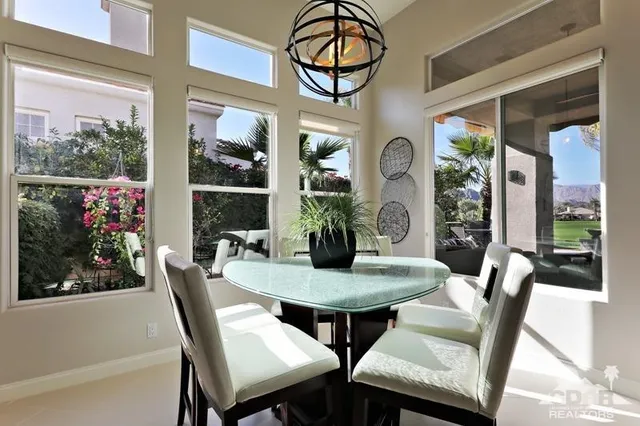 a view of a dining room with furniture window and outside view