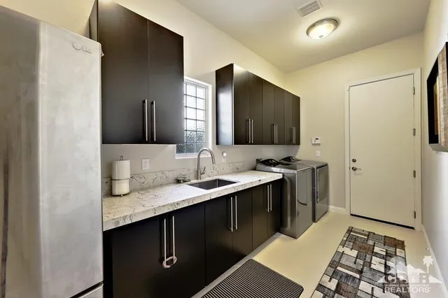 a hall with a sink and a mirror