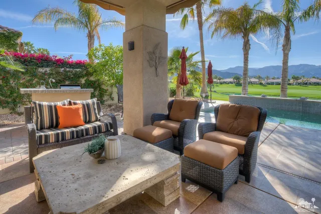 swimming pool view with a seating space