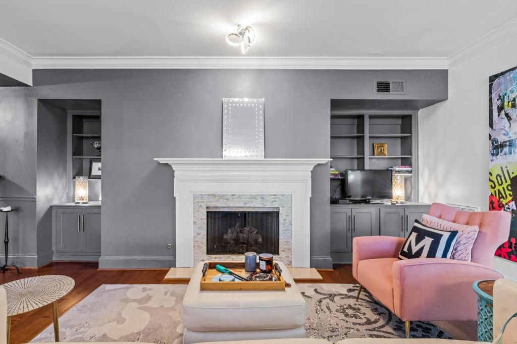 3638 Peachtree Road Northeast, Unit 406 Atlanta, GA 30319 - Photo 12 of 27 a living room with furniture and a fireplace