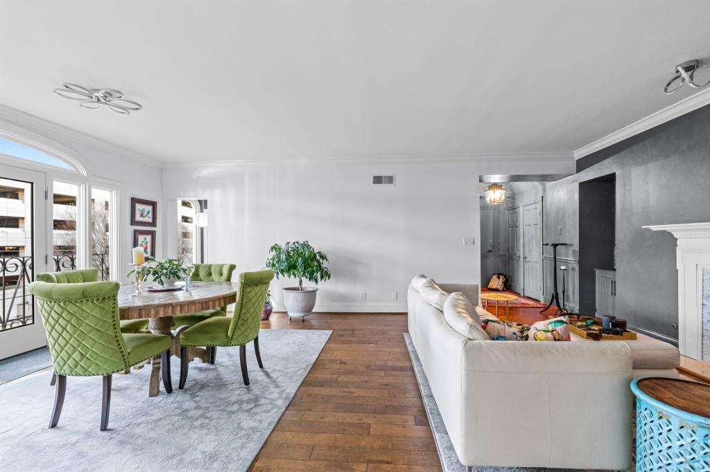 3638 Peachtree Road Northeast, Unit 406 Atlanta, GA 30319 - Photo 13 of 27 a dining room with furniture and a potted plant