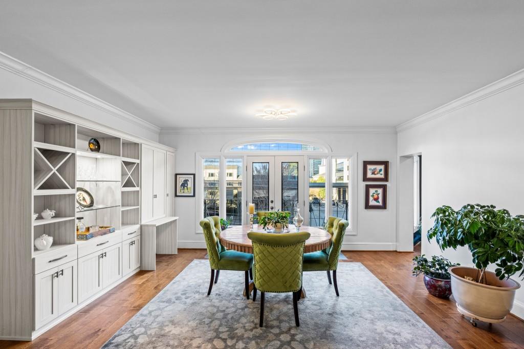 3638 Peachtree Road Northeast, Unit 406 Atlanta, GA 30319 - Photo 14 of 27 a view of a dining room with furniture and a potted plant