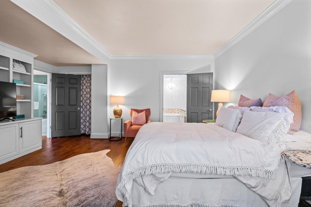 3638 Peachtree Road Northeast, Unit 406 Atlanta, GA 30319 - Photo 17 of 27 a large white bed in a white room