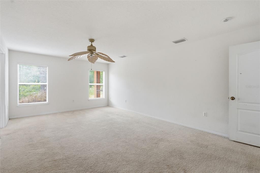 12005 Infinity Drive New Port Richey, FL 34654 - Photo 18 of 48 a view of empty room with windows