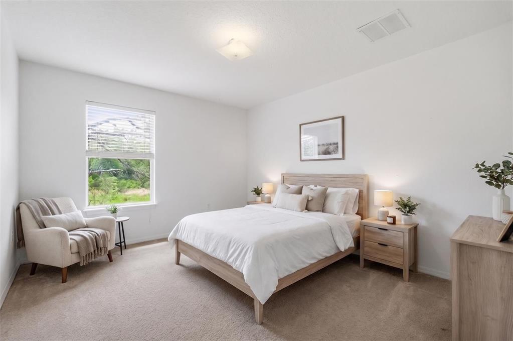 12005 Infinity Drive New Port Richey, FL 34654 - Photo 29 of 48 a bedroom with a bed and a couch