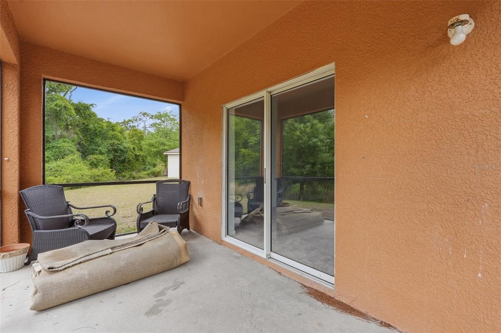 12005 Infinity Drive New Port Richey, FL 34654 - Photo 39 of 48 a living room with furniture and a large window