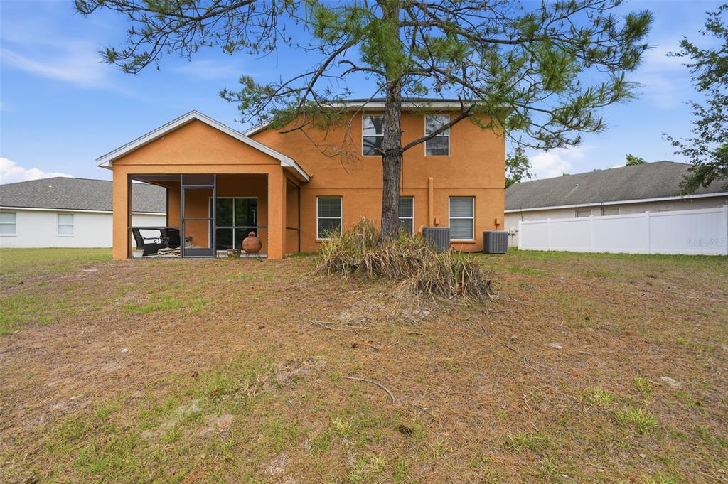 12005 Infinity Drive New Port Richey, FL 34654 - Photo 41 of 48 a front view of a house with a yard