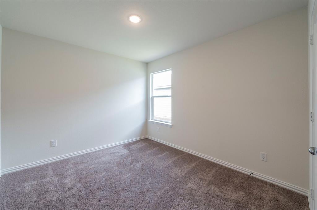 118 Goel Street Greenville, TX 75402 - Photo 10 of 12 an empty room with a window