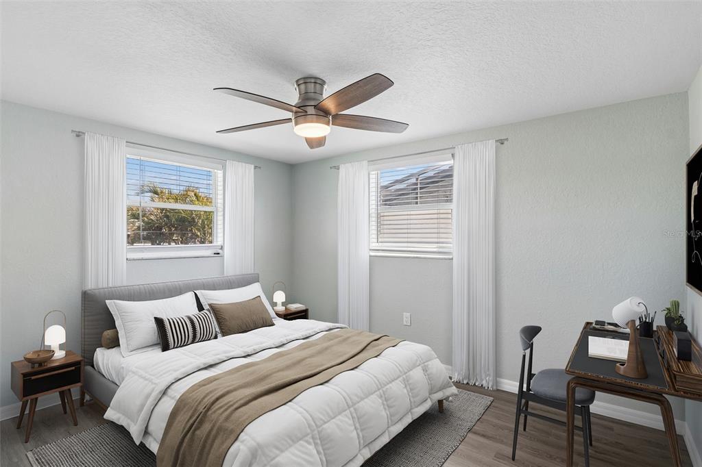 4417 Rudder Way New Port Richey, FL 34652 - Photo 11 of 47 a bedroom with bed and wooden floor