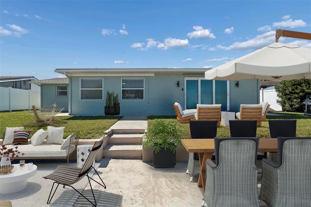 4417 Rudder Way New Port Richey, FL 34652 - Photo 14 of 47 a outdoor living space with furniture and a fireplace